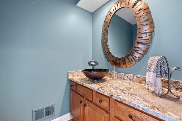 bathroom with visible vents and vanity