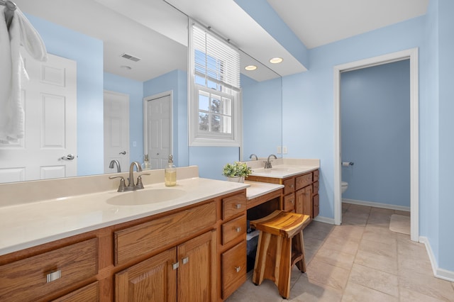 full bathroom featuring toilet, baseboards, a closet, and vanity