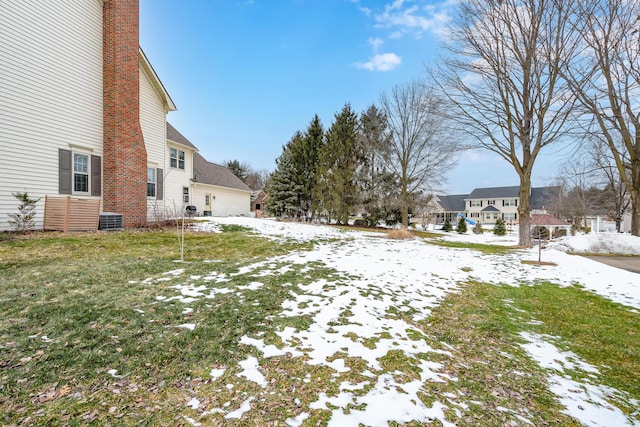 yard covered in snow featuring a gazebo and central AC unit