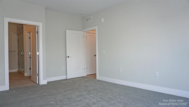 unfurnished bedroom with light carpet