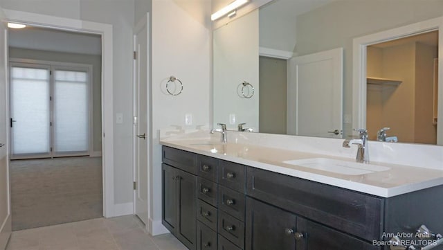 bathroom featuring tile patterned flooring and vanity