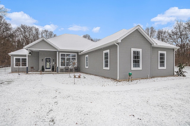 view of snow covered house