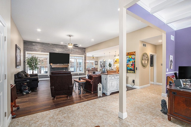 tiled living room featuring ceiling fan