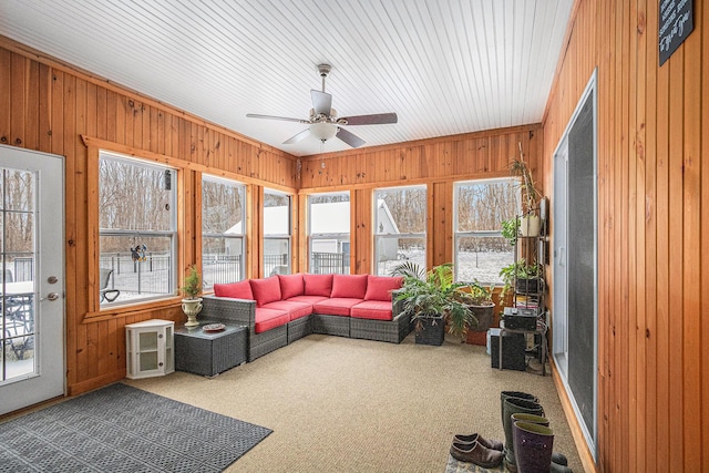 sunroom featuring ceiling fan