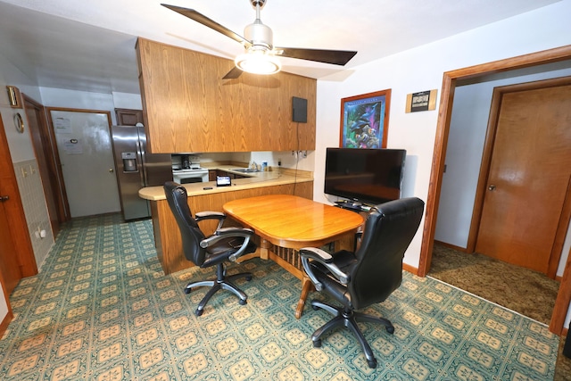 home office featuring sink and ceiling fan