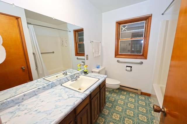 bathroom with vanity, toilet, and baseboard heating