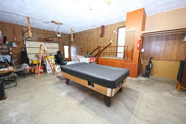 garage with wood walls