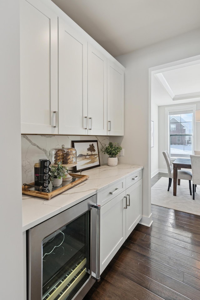 bar with white cabinets, tasteful backsplash, dark hardwood / wood-style floors, and wine cooler