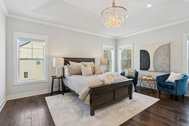 bedroom with multiple windows, crown molding, and dark hardwood / wood-style flooring