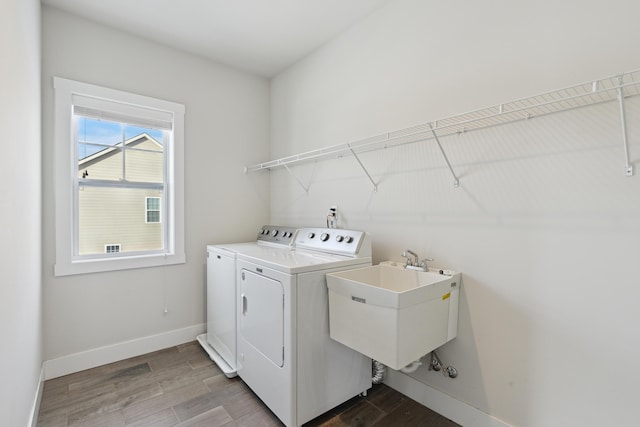 laundry room featuring sink and washer and clothes dryer