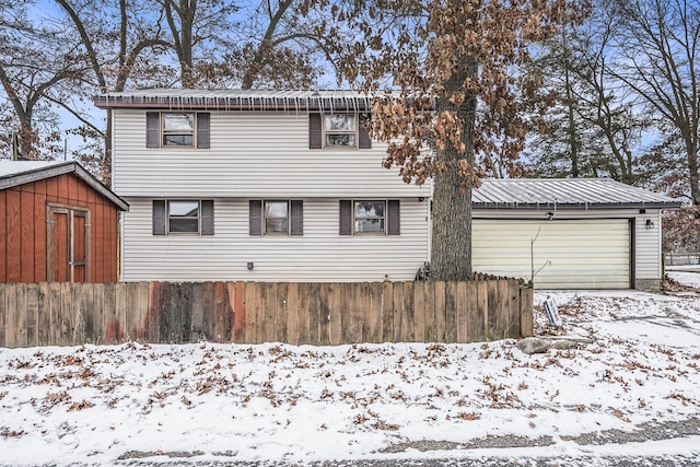 front facade featuring an outbuilding and a garage