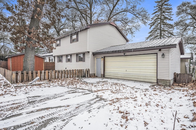 exterior space with a garage and an outdoor structure