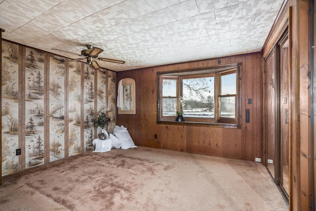 carpeted empty room with ceiling fan