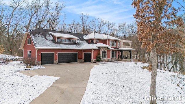 view of front of house with a porch and a garage