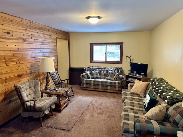 carpeted living room with wood walls