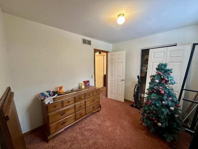 carpeted bedroom with a closet