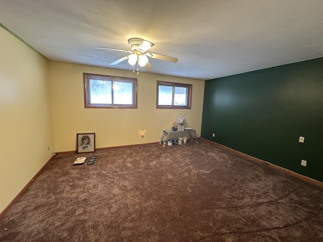 unfurnished room featuring carpet and ceiling fan