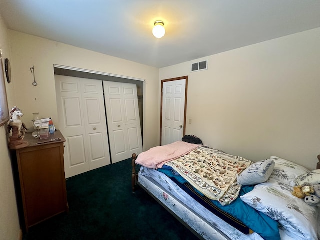 carpeted bedroom featuring a closet