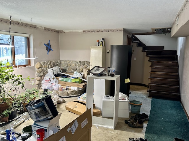 miscellaneous room with a textured ceiling