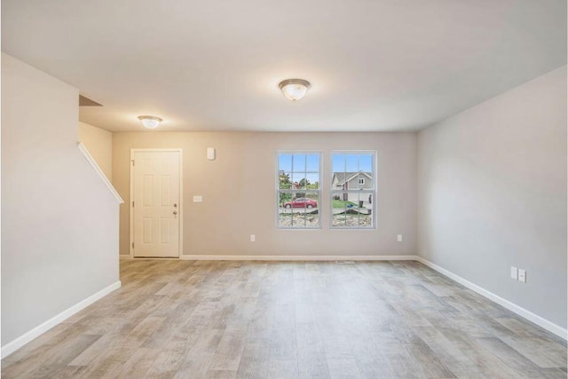 unfurnished room with light hardwood / wood-style flooring