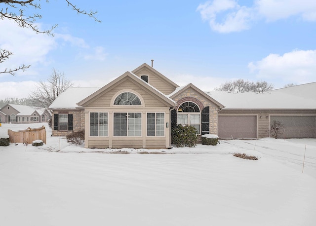 ranch-style house featuring a garage