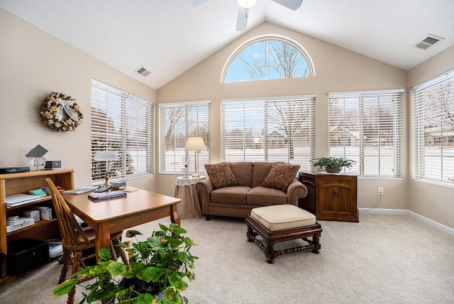 carpeted living room featuring a textured ceiling, ceiling fan, and lofted ceiling