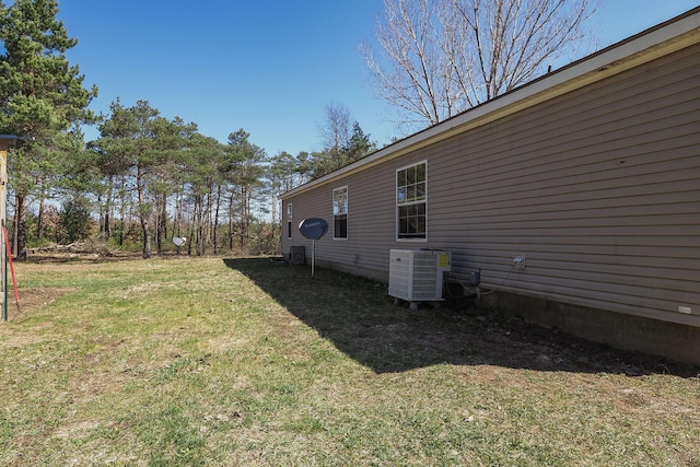 view of yard featuring central AC unit