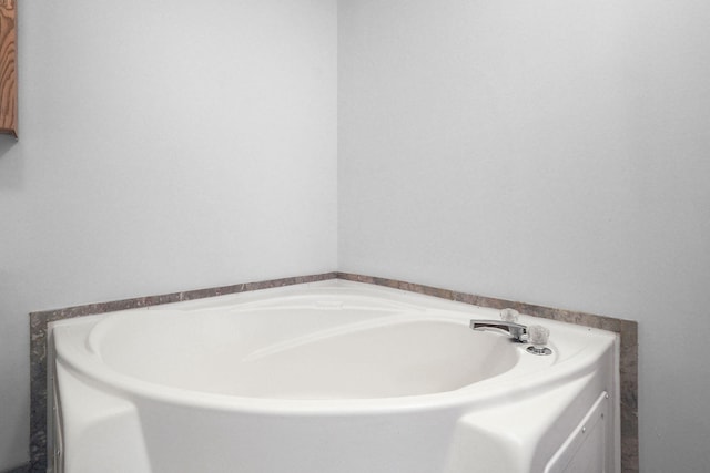 bathroom with a washtub