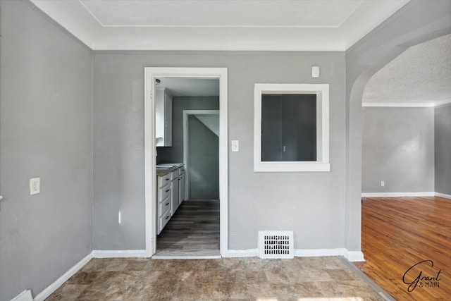 spare room featuring crown molding