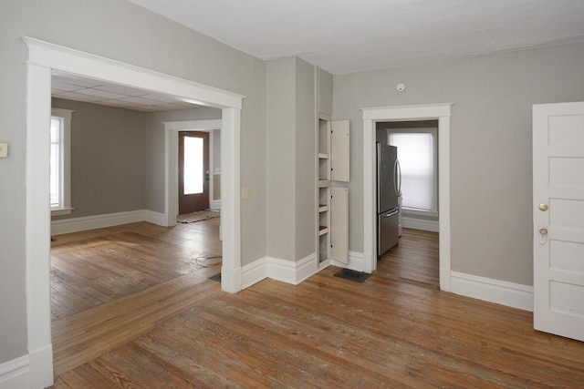 unfurnished room featuring hardwood / wood-style floors