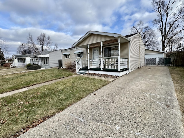 view of front of property with covered porch and a front lawn