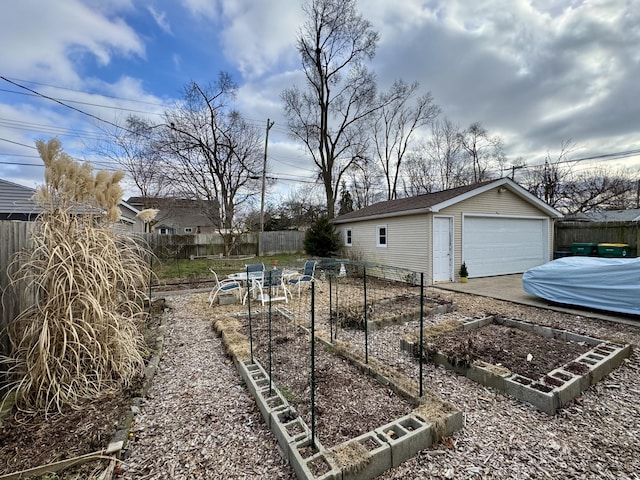 view of yard featuring a garage and an outdoor structure