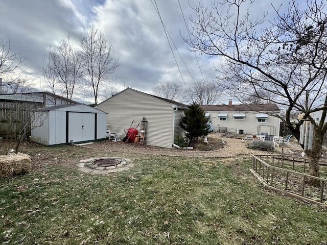 back of property featuring a yard and a fire pit