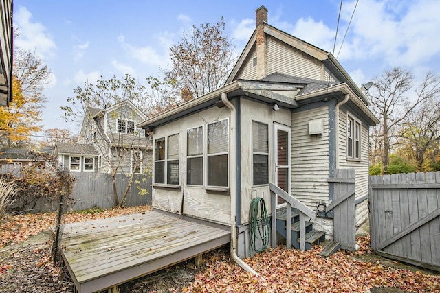 rear view of house with a wooden deck