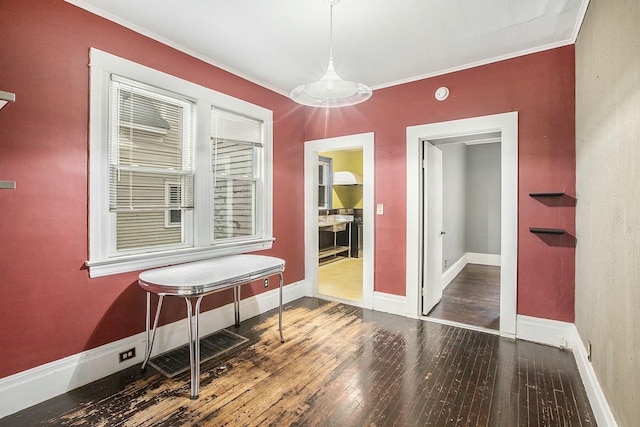 dining room featuring hardwood / wood-style floors and ornamental molding