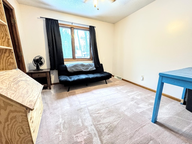 sitting room with light carpet