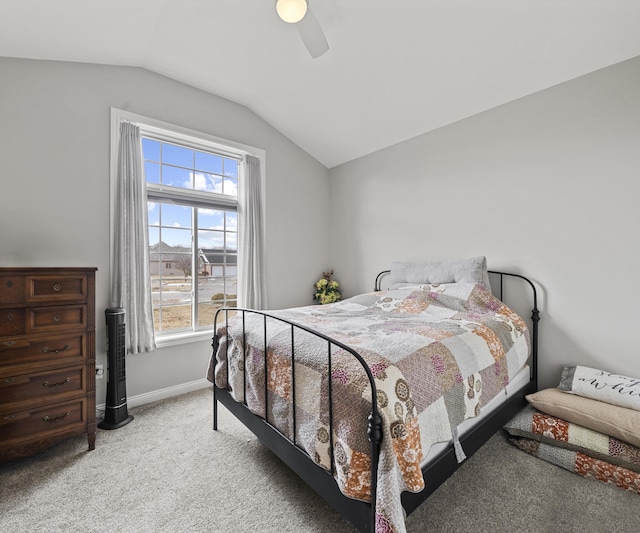 carpeted bedroom featuring lofted ceiling and ceiling fan