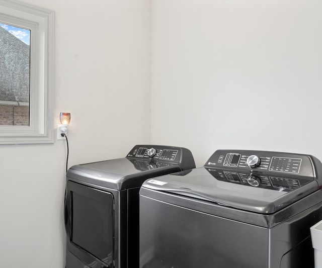 washroom with washing machine and dryer