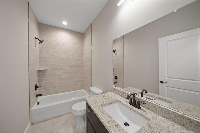 full bathroom with vanity, toilet, and tiled shower / bath combo