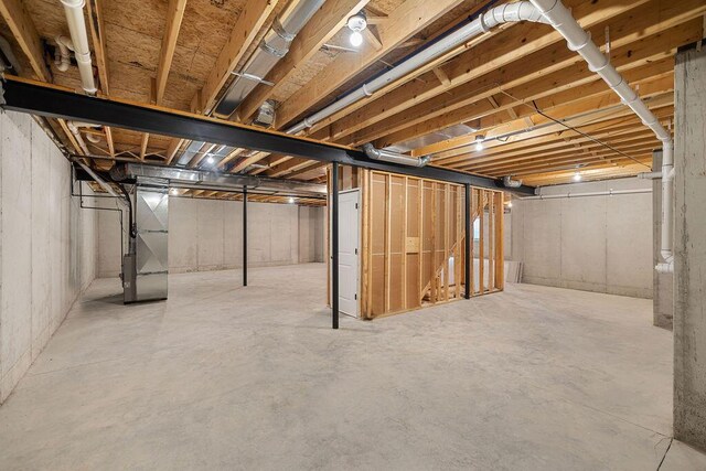 basement featuring heating unit