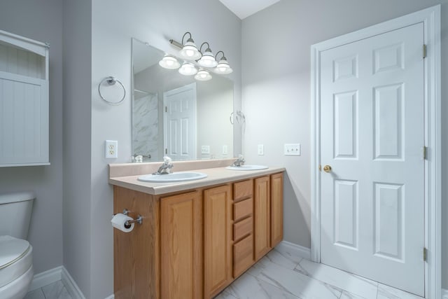 bathroom with vanity and toilet