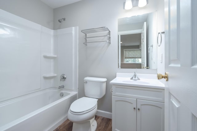 full bathroom with hardwood / wood-style floors, vanity, toilet, and shower / tub combination