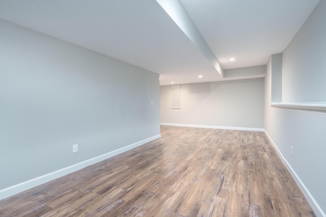 basement featuring hardwood / wood-style floors