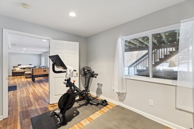 workout room with hardwood / wood-style floors