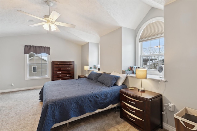 bedroom with lofted ceiling, ceiling fan, carpet flooring, and a textured ceiling