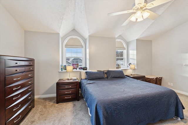 carpeted bedroom with ceiling fan, lofted ceiling, a textured ceiling, and multiple windows