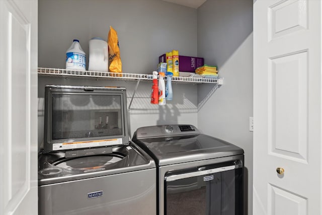 laundry area with separate washer and dryer