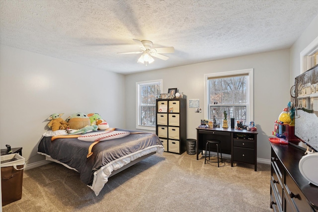 bedroom with light carpet, a textured ceiling, and ceiling fan