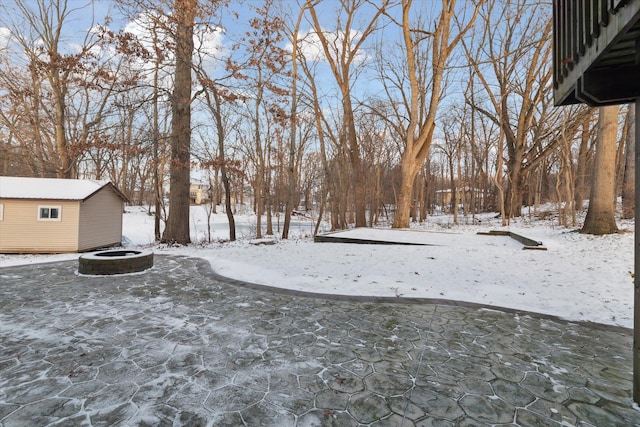 view of yard layered in snow