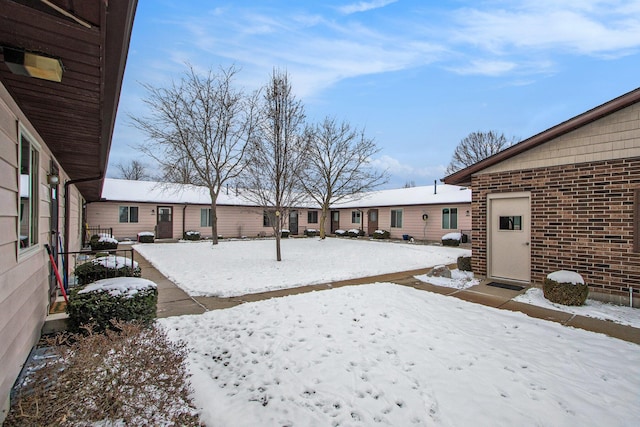 view of yard layered in snow